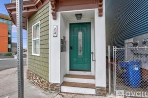Boston apartment for rent - A house with a green door and number 24 on the wall.
