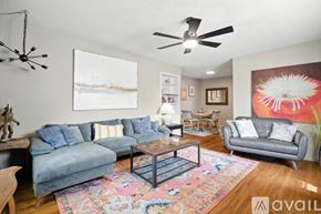 Lubbock townhouse for rent - A living room with a couch, chair, and rug.