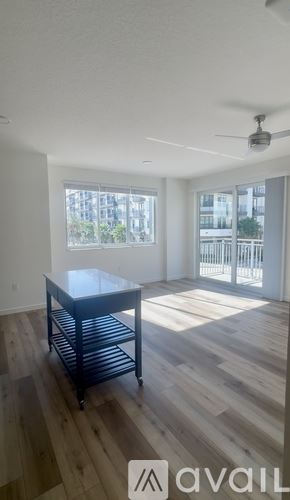 Tampa apartment for rent - A spacious room with a sliding glass door leading to a balcony.