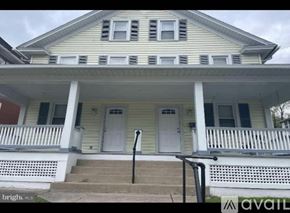 Bellefonte apartment for rent - A two-story house with a porch and a white door.
