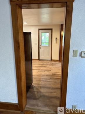 Bellefonte apartment for rent - A wooden doorway leading to a room with a white door.