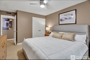Newburgh apartment for rent - A bedroom with a large bed and a ceiling fan.
