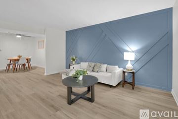 Newburgh apartment for rent - A living room with a white couch and a coffee table.