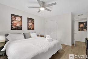 Newburgh apartment for rent - A bedroom with a large bed and a ceiling fan.