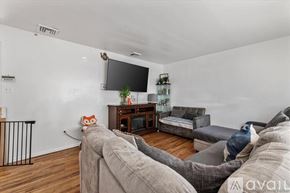 Hempstead apartment for rent - A staircase with a black railing and wooden steps.