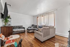 Hempstead apartment for rent - A room with wooden flooring and a balcony with a railing.