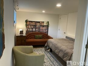 Ellsworth apartment for rent - A white refrigerator with its door open and shelves visible.