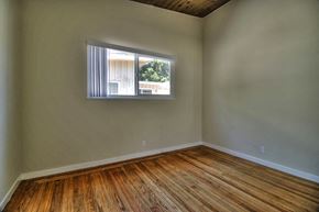 Palo Alto apartment for rent - A room with wooden flooring and a window.