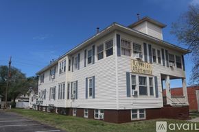 Hutchinson apartment for rent - A building with the sign "Rent to Own Apartments" on the front.