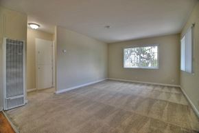 Sunnyvale apartment for rent - A room with a carpeted floor and a window with blinds.
