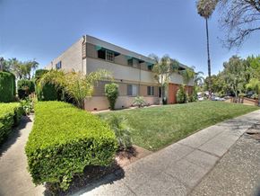Sunnyvale apartment for rent - A modern house with a well-maintained lawn and a clear blue sky.
