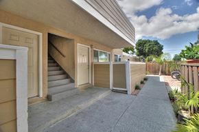 Sunnyvale apartment for rent - the front of a building with stairs and a sidewalk