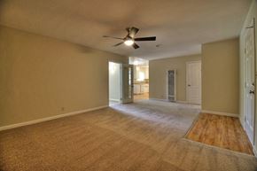 Sunnyvale apartment for rent - Empty room with a ceiling fan and carpeted floor.