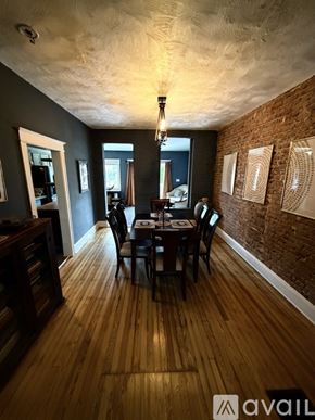 Washington house for rent - A dining room with a wooden table and chairs.