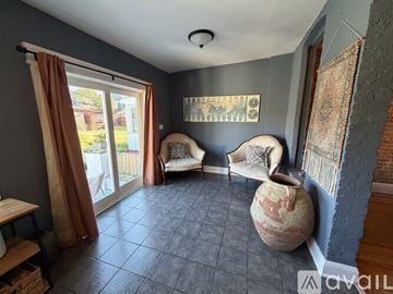 Washington house for rent - A living room with a brown leather couch and a wooden coffee table.