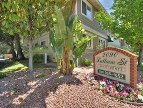 Mountain View apartment for rent - a sign in front of a house with a palm tree