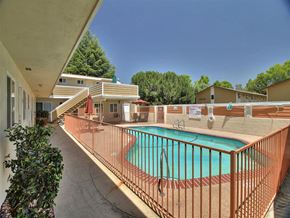 Mountain View apartment for rent - a swimming pool with a wrought iron fence around it