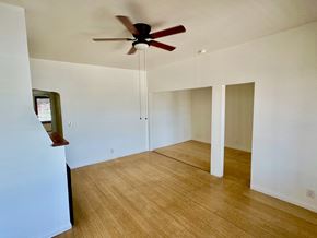 Los Angeles apartment for rent - A room with a ceiling fan and wooden flooring.