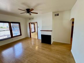 Los Angeles apartment for rent - A room with a ceiling fan and wooden flooring.
