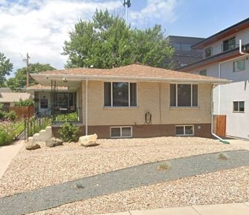 Denver house for rent - A house with a brown roof and a gravel driveway.