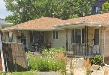 Denver house for rent - A house with a brown roof and a balcony.