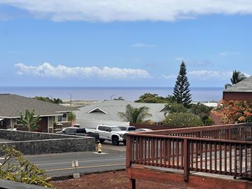 Kailua-Kona apartment for rent - A white car is parked on a street.