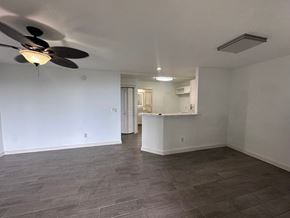 Kailua-Kona apartment for rent - A room with a ceiling fan and a kitchenette.