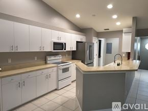 Lehigh Acres apartment for rent - A house with a well-maintained lawn in front.