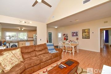 St. Augustine house for rent - A living room with a brown couch and a wooden coffee table.