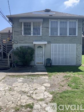 Berry Hill house for rent - A house with a grey facade and a white fence.