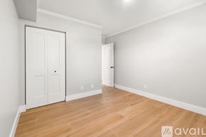 North Palm Beach apartment for rent - A room with a white door and a wooden floor.