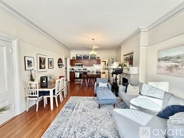 Boston apartment for rent - A living room with a white couch and a rug.