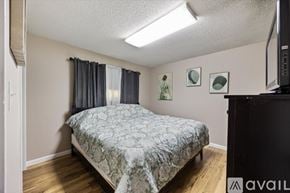 Sacramento house for rent - A bedroom with a bed, a dresser, and a television.