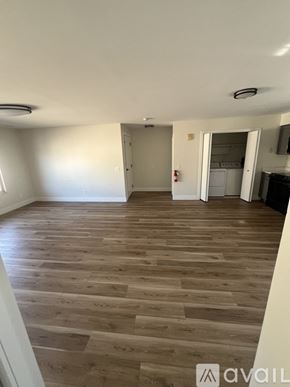 Wyandotte apartment for rent - A room with wooden flooring and a white ceiling.