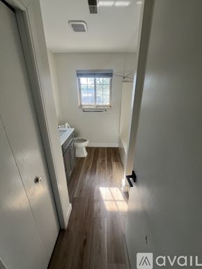 Wyandotte apartment for rent - A small bathroom with a toilet and sink.