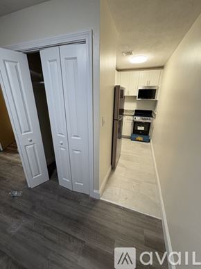 Boston apartment for rent - A kitchen area with a refrigerator, oven, and microwave.