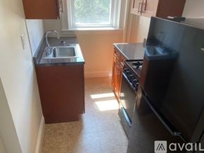 Boston apartment for rent - A kitchen with a sink, stove, and oven.