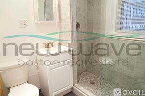 Boston apartment for rent - A bathroom with a toilet, sink, and shower.