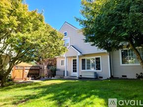 Sebastopol house for rent - A house with a well-kept lawn and trees in the front yard.