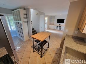 Sebastopol house for rent - A bedroom with a bed, a ceiling fan, and a window with blinds.