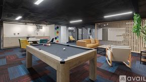 Chicago apartment for rent - A pool table is in the middle of a room with a wooden floor and a wooden wall.