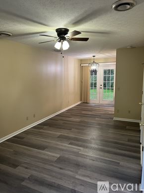 Prestonsburg apartment for rent - A room with a ceiling fan and light fixture.