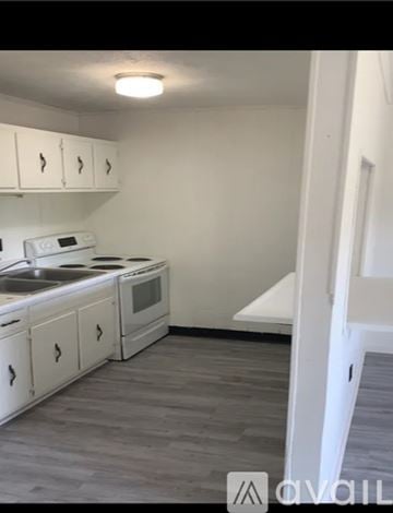 Morristown apartment for rent - A kitchen with white cabinets and a white oven.