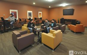 Whitewater apartment for rent - A bedroom with a bed, desk, and chair.