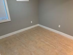 Washington apartment for rent - A room with light brown flooring and white trim.