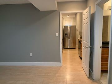 Washington apartment for rent - A kitchen with a refrigerator and a countertop.