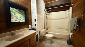 Sitka house for rent - A bathroom with a sink, toilet, and bathtub.