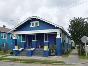 New Orleans apartment for rent - A blue house with a white door and windows.