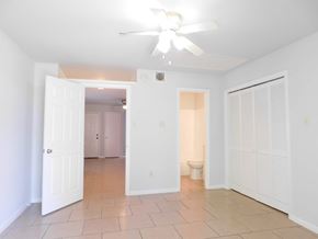 Hammond apartment for rent - A room with a ceiling fan and tile flooring.