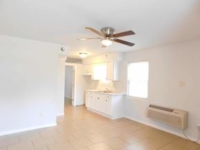 Hammond apartment for rent - A white room with a ceiling fan and a window.